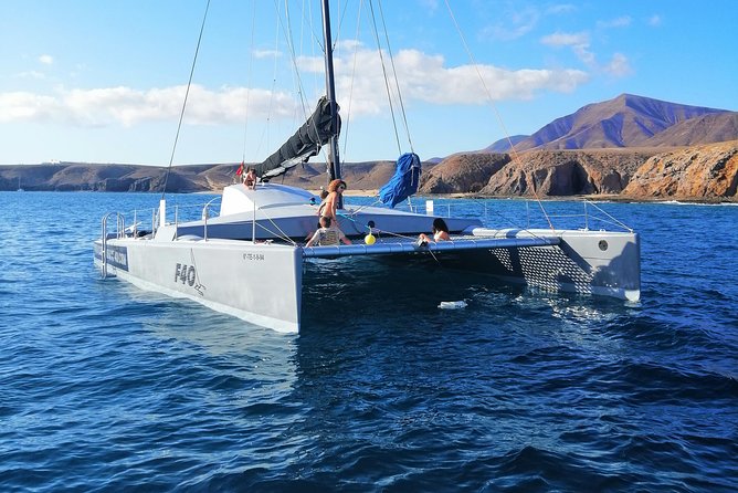 Catamaran F40 Lanzarote sailing - Playa Blanca meet-up at 11:00 and how the day typically flows