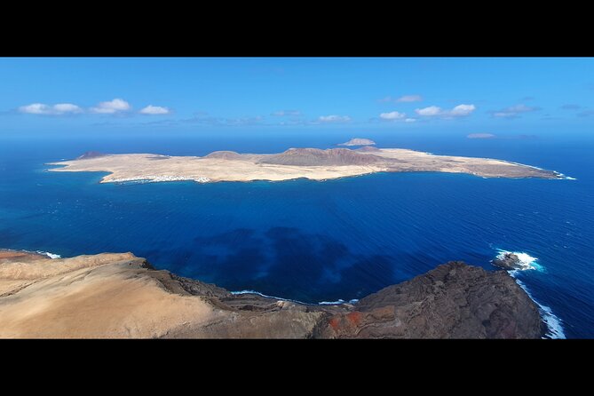 DISCOVERY FLIGHT tandem paragliding Lanzarote with pro pilot - Photos and Video Included: A Souvenir That Actually Helps