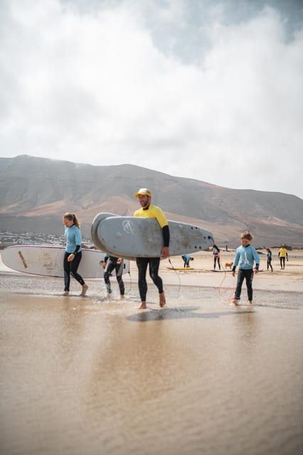 Famara Beach: Surfing Lessons with Videos - Equipment and pacing: wetsuit and board, then real wave time
