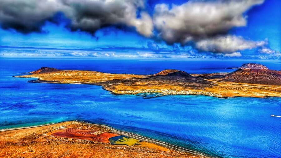 Lanzarote: Full-Day Island Highlights Tour - The Guinate and Haría moments: palms, scenery, and a breather