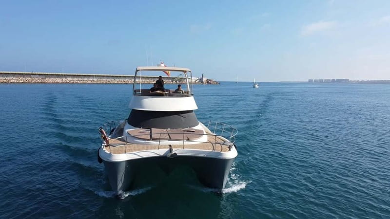 Puerto del Carmen: Private Sunset Catamaran Tour with Drinks - The coastal sail-out: Puerto Calero, Playa Quemada, and Punta Gorda