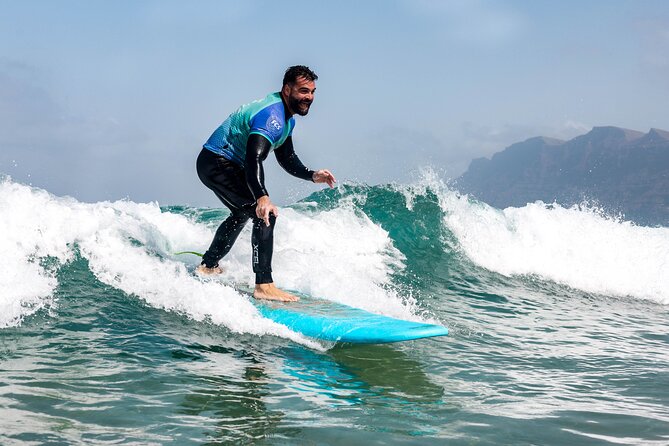 Surf Lesson for Beginners in Famara: Introduction in Surfing - Where You Start: Red Star Surf & Yoga Camp to the Beach