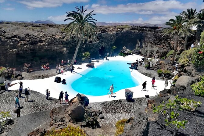 Tour to Timanfaya, Jameos del Agua, Cueva de los Verdes and viewpoint from the cliff - Mirador de Guinate and Haría: palms, cliffs, and La Graciosa views