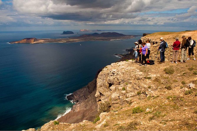 Walking Tour through La Corona Volcano and Famara Cliff - Ascending Toward La Corona: Malpaís, Vineyards, and Crater Views